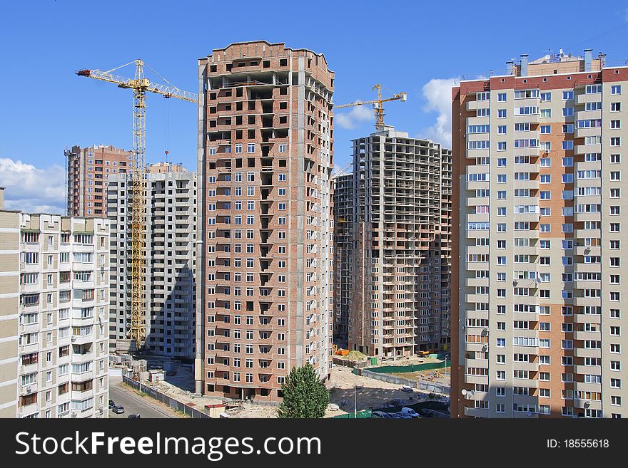 Residential houses under construction in a new city district