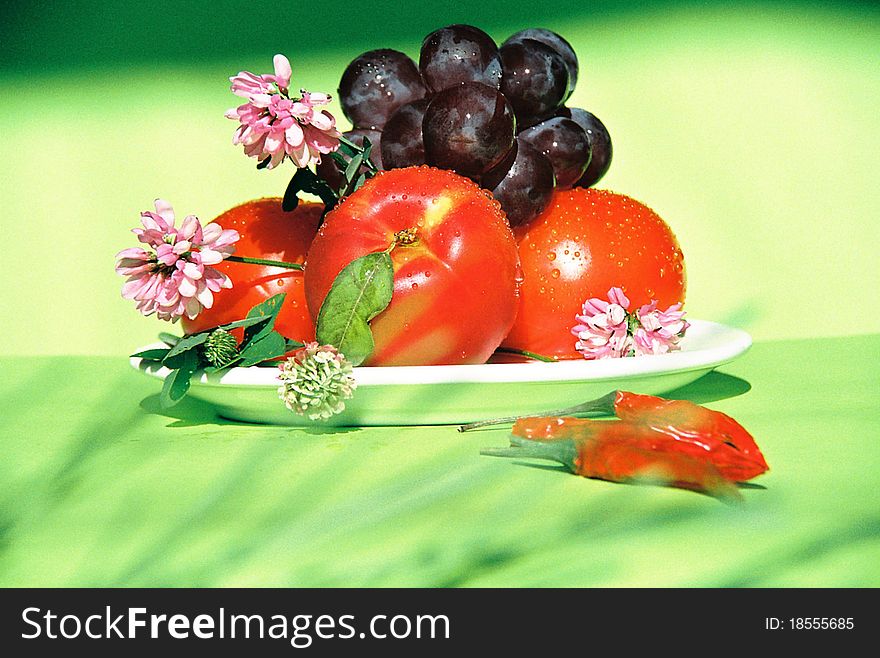 Tomato, nectarine, grapes, chili and clover. Tomato, nectarine, grapes, chili and clover