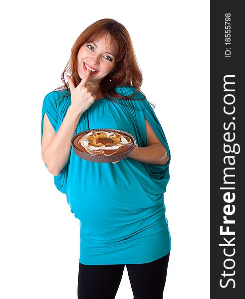 A smiling woman is tasting the cake. isolated on a white background