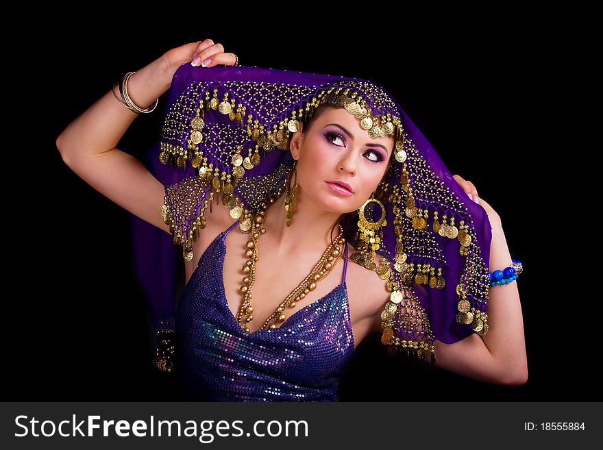 Beautiful girl in a stylized ethnic costume and shawl