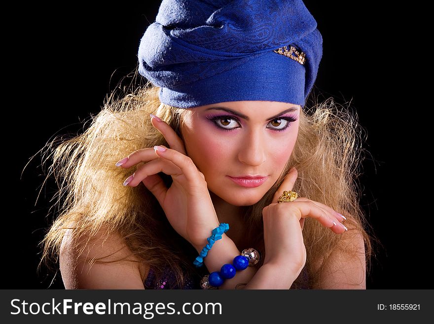 Beautiful girl in a turban and a stylized ethnic costume