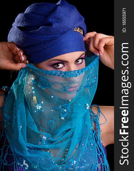 Beautiful girl in the stylized ethnic turban and veil