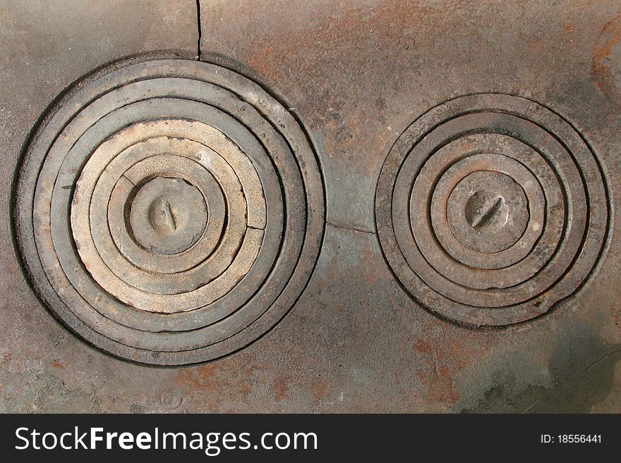 Two ancient kitchen stove rings