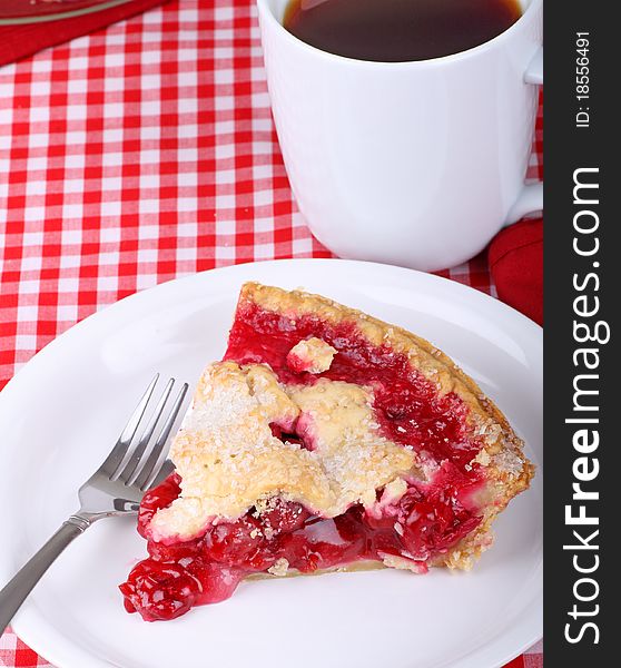 Slice of cherry pie and a cup of coffee