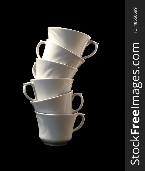 Six white classical cups and black background. Six white classical cups and black background