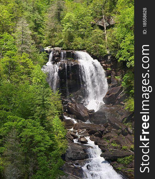 Beautiful white water falls in the plush spring mountains of Western North Carolina. the highest falls east of the Rockies. Beautiful white water falls in the plush spring mountains of Western North Carolina. the highest falls east of the Rockies.