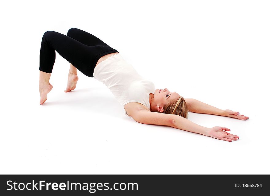 Beautiful girl practicing yoga on white background
