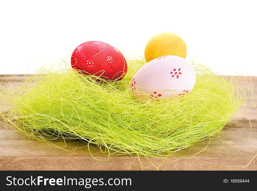 Colorful easter eggs on wooden background