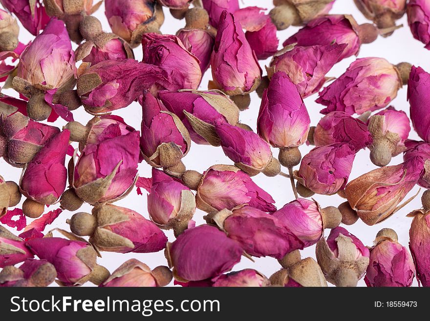 Buds of dried roses as background