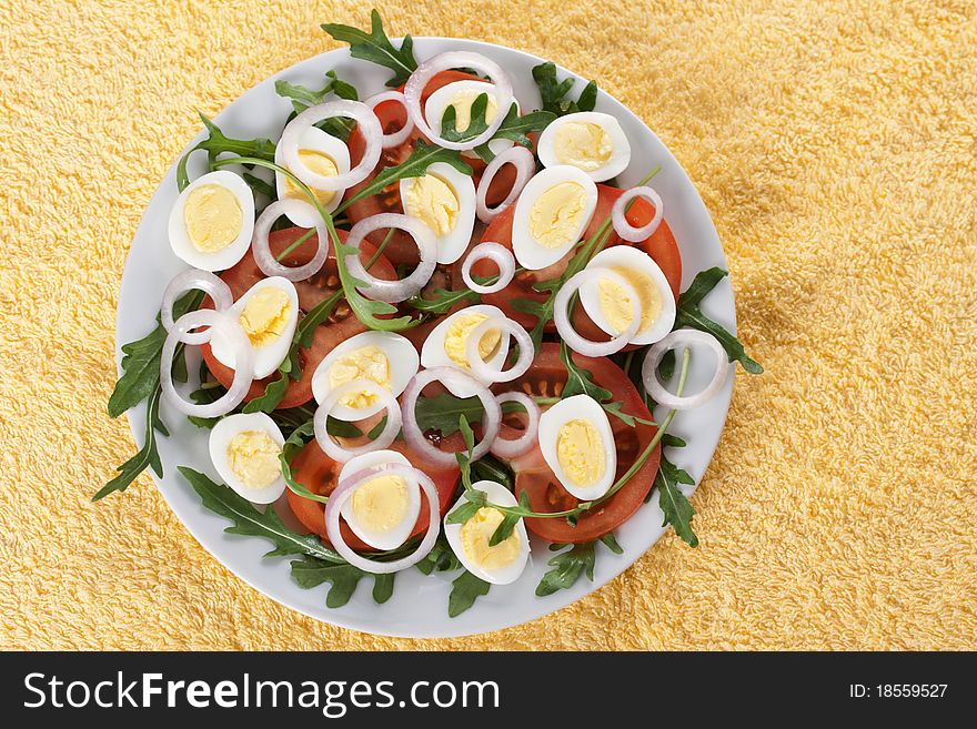 Healthy salad with tomatoes, onions, eggs and rucola. Healthy salad with tomatoes, onions, eggs and rucola