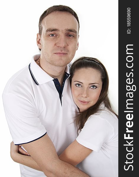 Young adults  man and woman in casual style stand on white isolation. Young adults  man and woman in casual style stand on white isolation