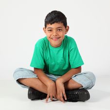 Happy Young School Boy 10 Sitting On The Floor Stock Images Happy Young School Boy 10 Sitting On The Floor Stock Images