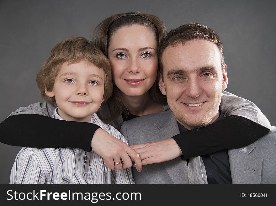 European family from three persons - mother, father and son. European family from three persons - mother, father and son.