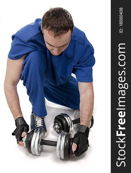 Healthy muscular bodybuilder exercising with dumbbells. White isolated. Healthy muscular bodybuilder exercising with dumbbells. White isolated.