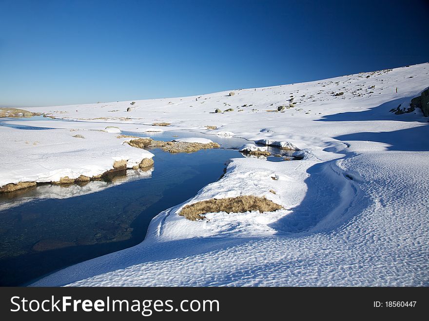 Curve river at snow mountain