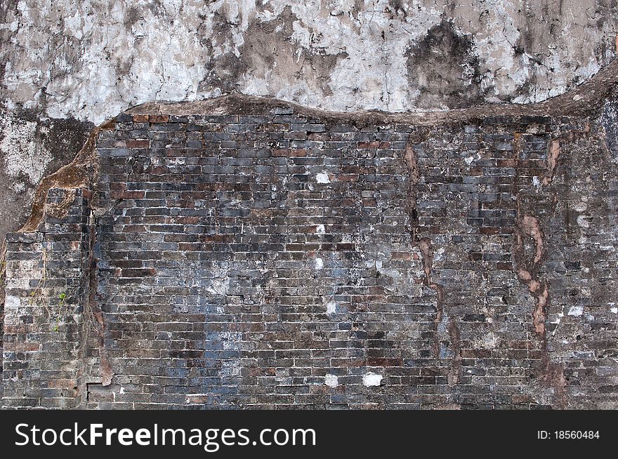 Damaged gray white dirty repaired concrete wall. Damaged gray white dirty repaired concrete wall