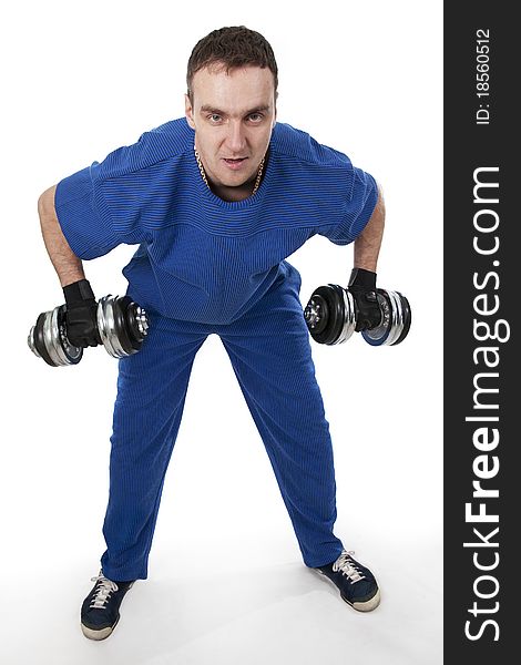Healthy muscular bodybuilder exercising with dumbbells.White isolated. Healthy muscular bodybuilder exercising with dumbbells.White isolated.
