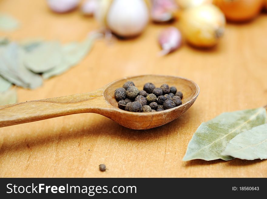 An image of spices on wooden table. An image of spices on wooden table