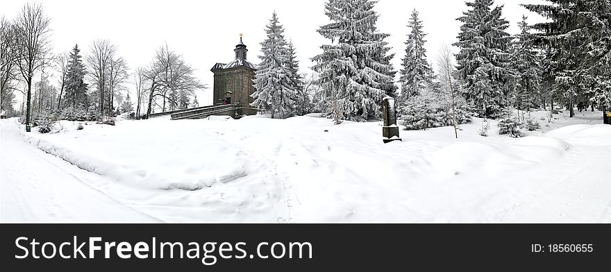 Panorama of winter wonderland with medieval chaple, Czech Republic, Europe.