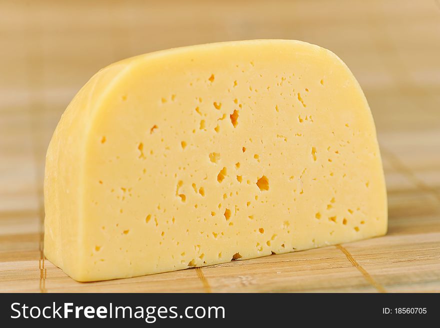 Large piece of tasty  cheese isolated. Large piece of tasty  cheese isolated