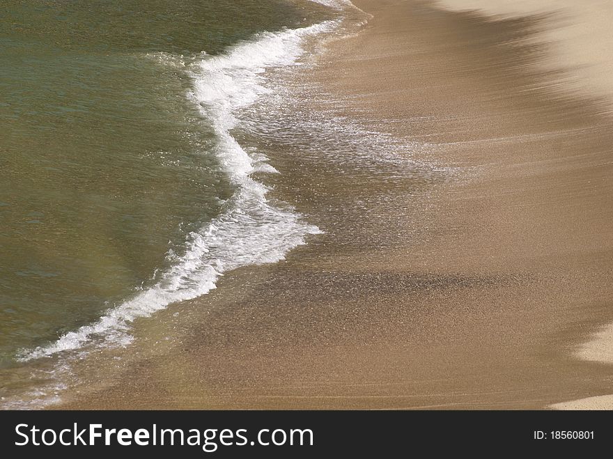 Ocean Surf On Sandy Beach