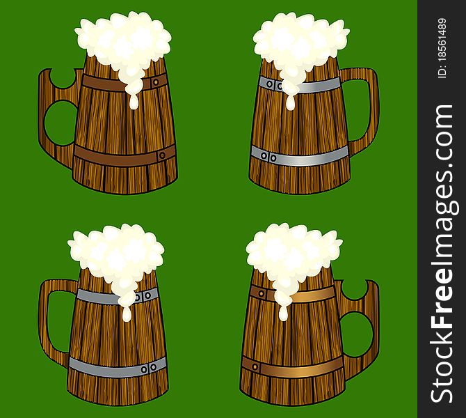 Four wooden beer mugs with the overflowing foam