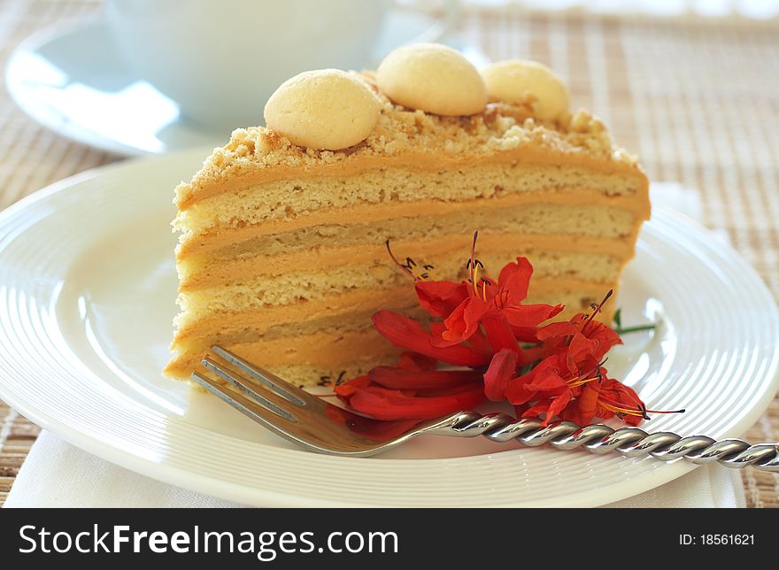 Caramel medovik cake made of honey and caramel cream, decorated with flowers