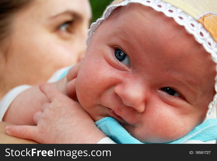Portrait newborn child or woman, closeup face