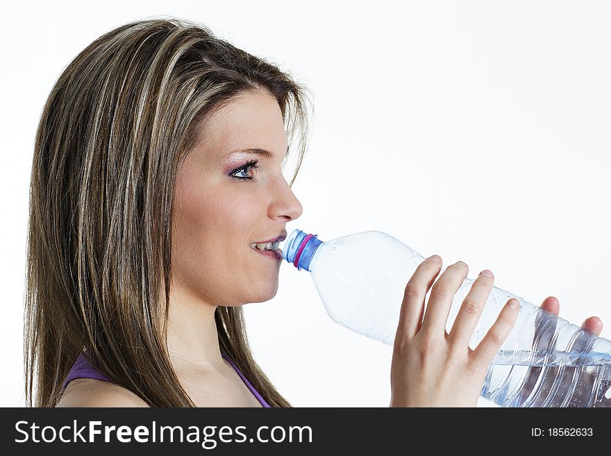 Beautiful blond woman drinking water