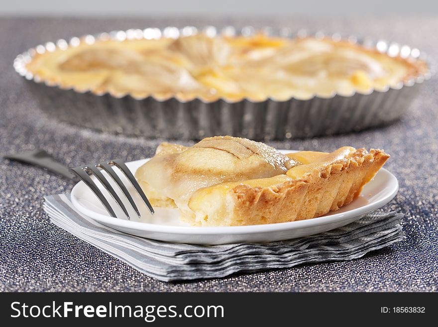 Tart from pears in the baking dish. Tart from pears in the baking dish