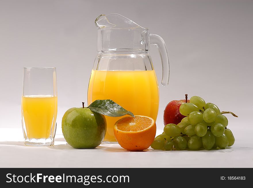 Fresh juice in a jar and fresh fruit