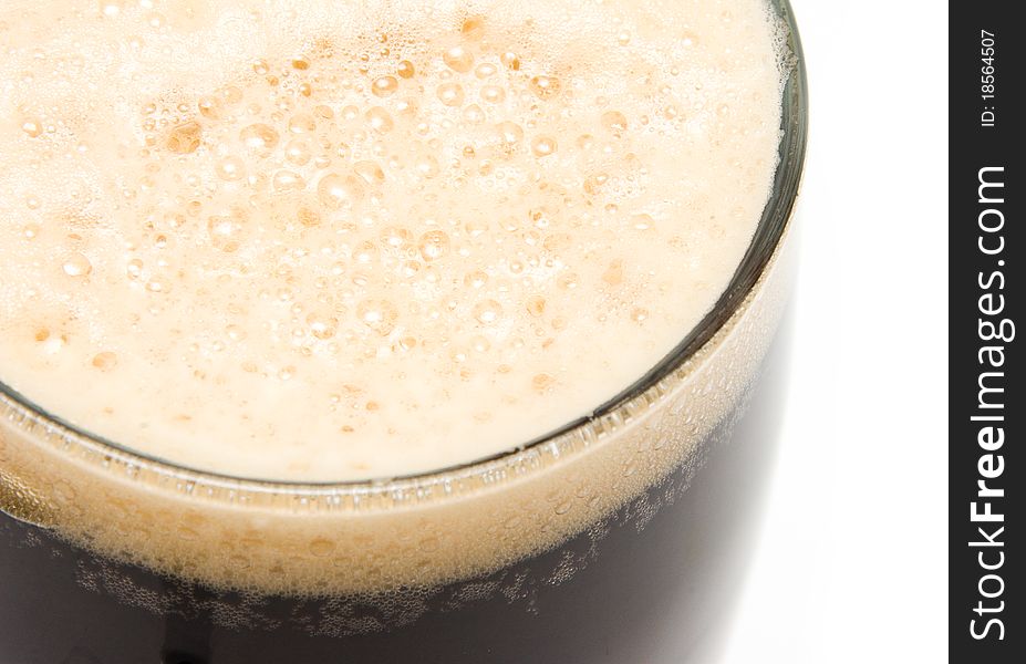 Glass of dark beer close up.
