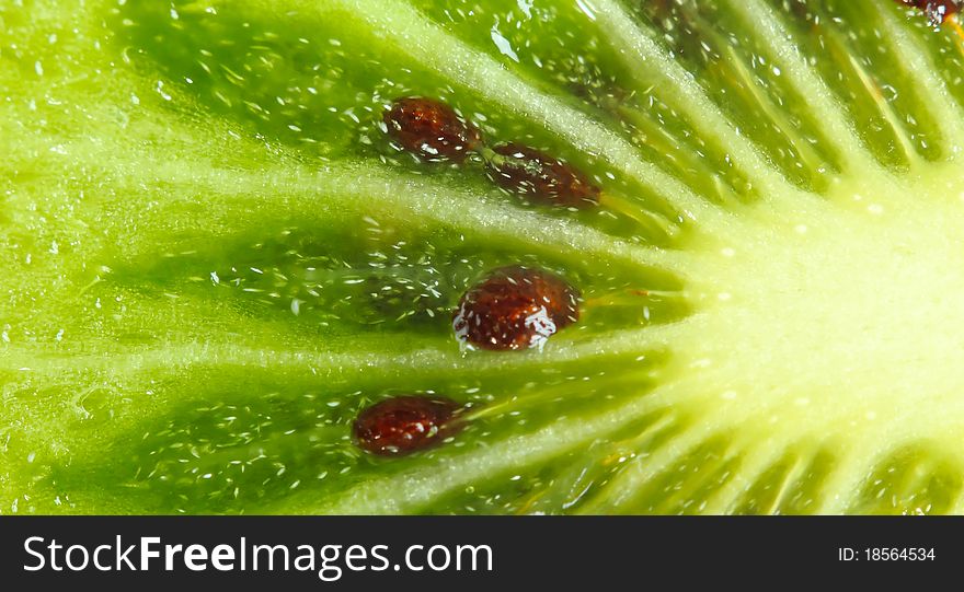 Part of fruit of a kiwi close up. Part of fruit of a kiwi close up