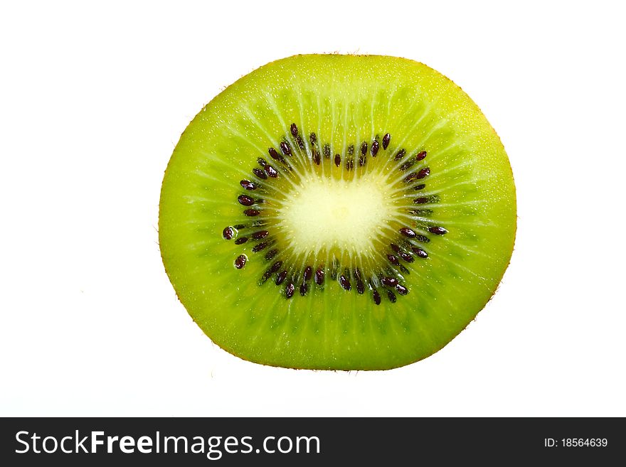 A single slice of kiwi fruit on a white background