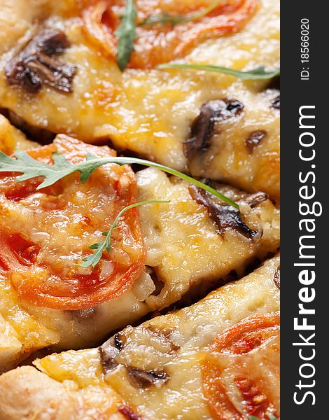 Fresh baked pizza with mushroom, tomatoes and rucola. Fresh baked pizza with mushroom, tomatoes and rucola