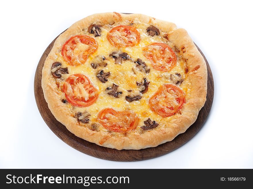 Fresh baked pizza with mushroom and tomatoes