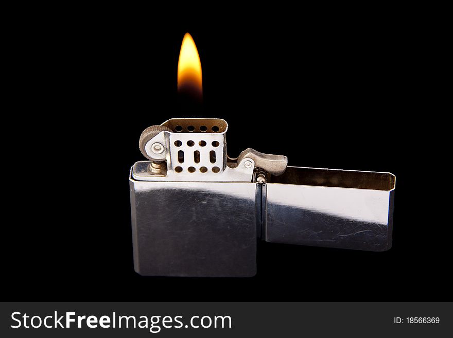 Lighter with Flame on black background