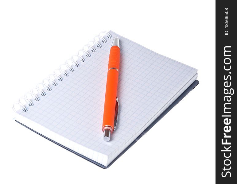 Orange pen and notebook on white background close-up (isolated). Orange pen and notebook on white background close-up (isolated).