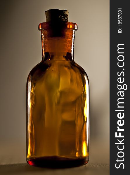 Small glass bottle. with cover (cap). brown glass