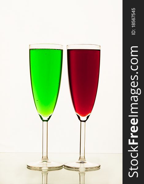 Lemonade in glasses and bottles of red, green color