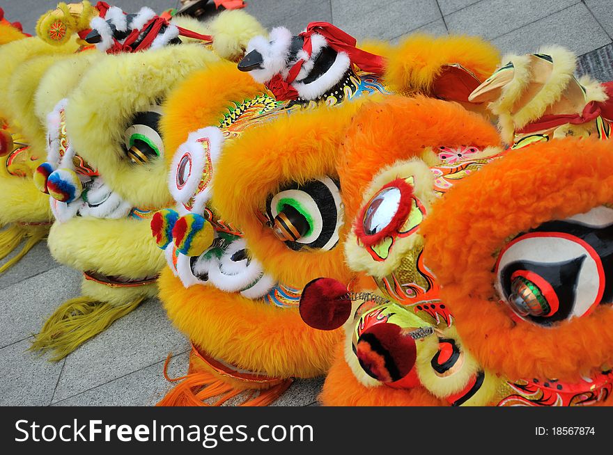 The traditional performing of lion dance in Chinese traditional style, popular in new year day for lucky wish and happiness. The traditional performing of lion dance in Chinese traditional style, popular in new year day for lucky wish and happiness.