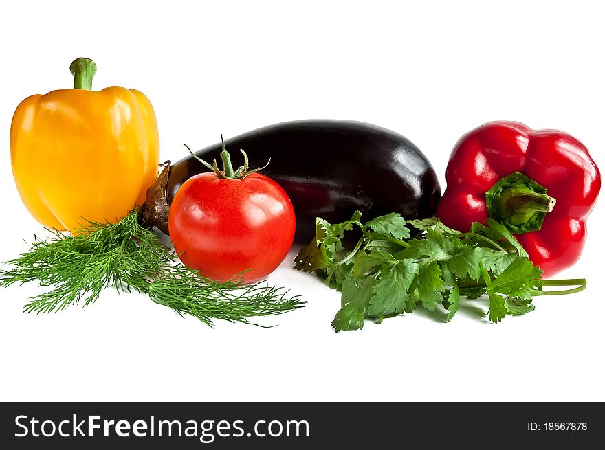 Red and yellow pepper, tomato and eggplant with greens. Red and yellow pepper, tomato and eggplant with greens.