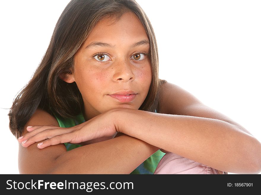 Close up of teenager girl, 13, relaxed with chin resting on hand photographed in studio. Close up of teenager girl, 13, relaxed with chin resting on hand photographed in studio