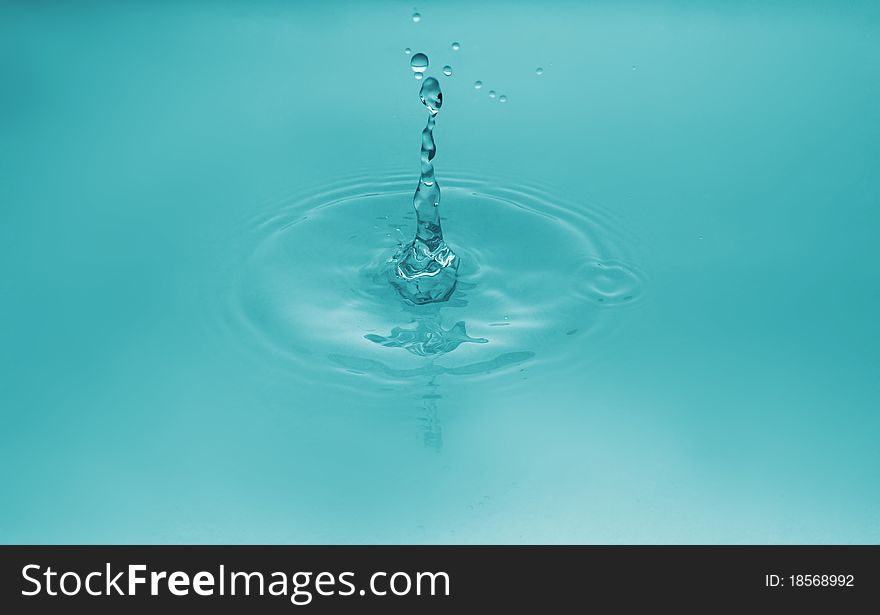 Falling of a drop of water. Water splashing