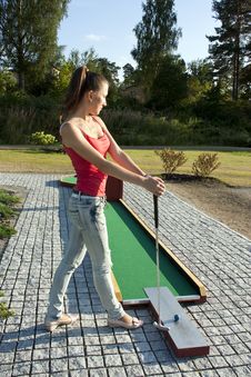 Young Woman Playing Golf In A Country Club Stock Photo