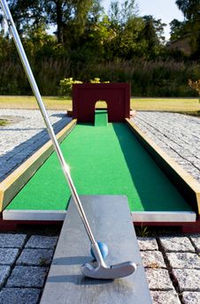 Putting At A Mini Golf Leisure Facility. Stock Photo Putting At A Mini Golf Leisure Facility. Stock Photo