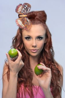 Woman With Limes Stock Photos