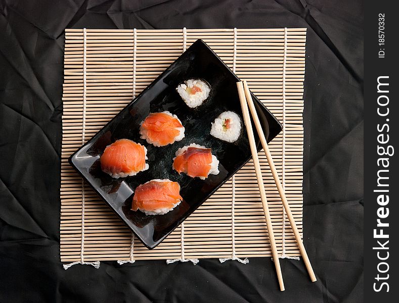 Served sushi on a black cloth. Served sushi on a black cloth