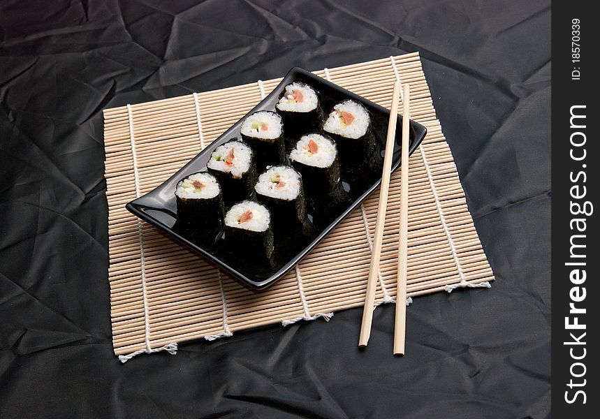 Served sushi on a black cloth. Served sushi on a black cloth