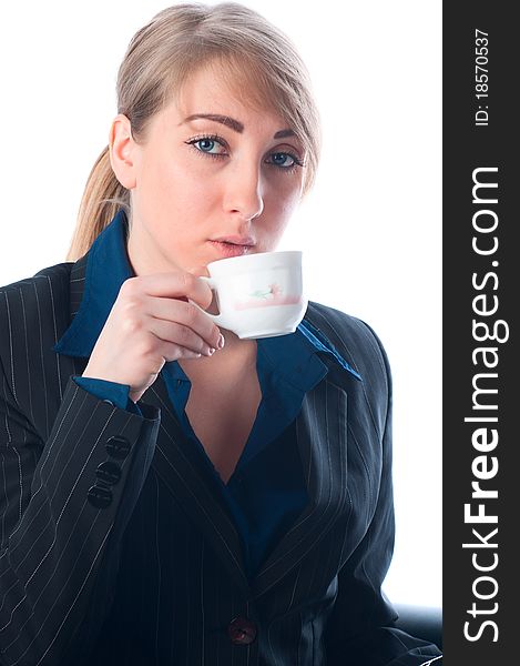 The businesswoman on a break drinks coffee